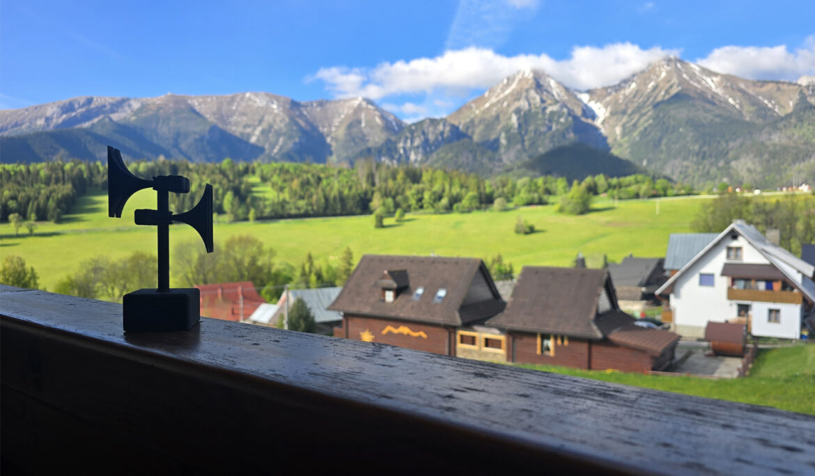 Scenic view of Ždiar village with Telegrafia siren model in the foreground representing company teambuilding 2025