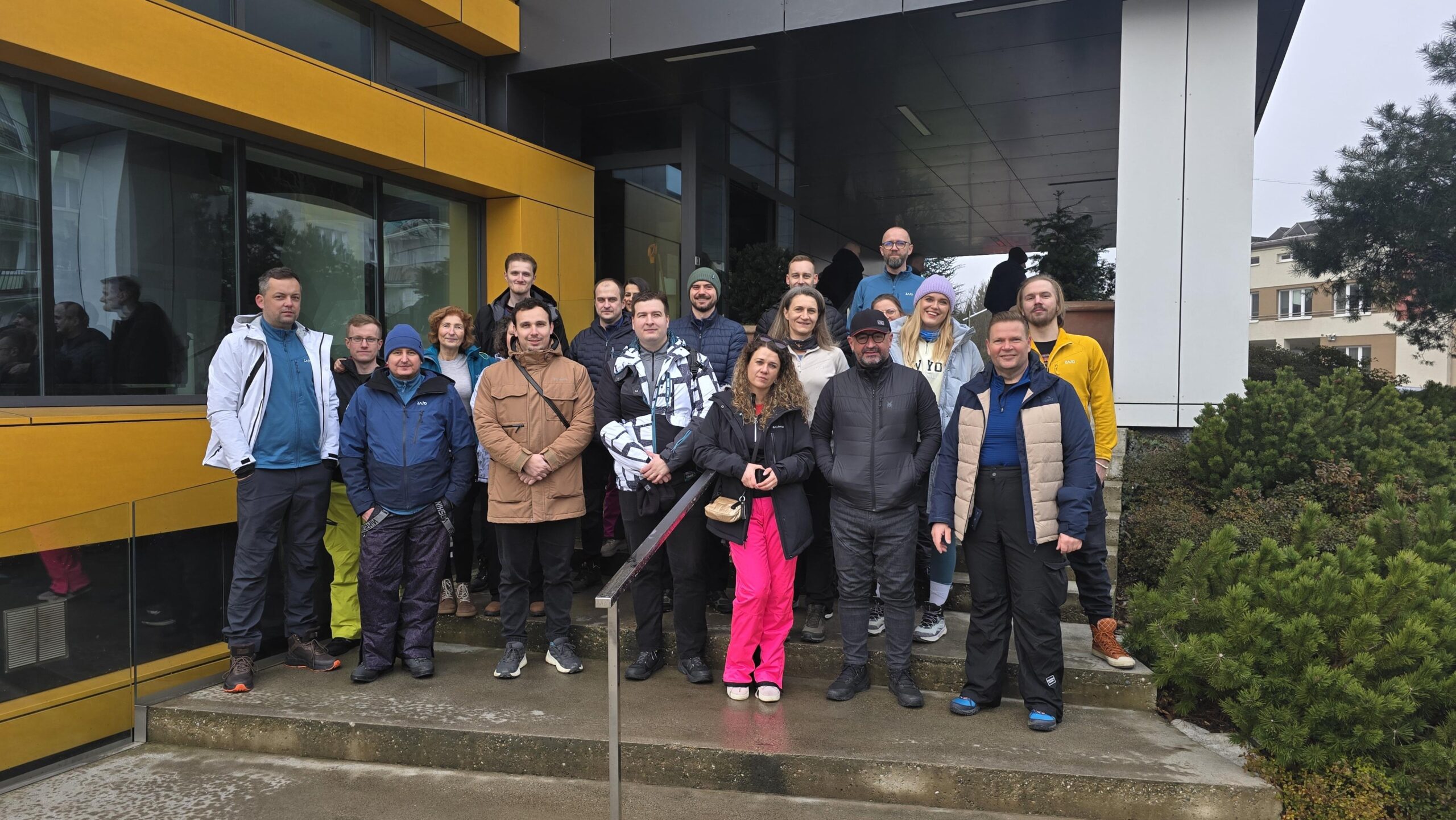 Four Telegrafia teams in front of the company building before teambuilding departure